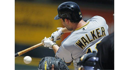 Pirates second baseman Neil Walker throws to first base to put out Colorado Rockies' Tyler Colvin in the first inning of Wednesday's game in Denver.