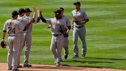 The Pirates celebrate on the field after defeating the Colorado Rockies 9-6 to win the three-game series at Coors Field  in Denver, Colorado.