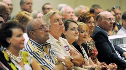 Gene Waszkiewicz, third from left, listens to the panel discussion. He said his transmission business in Washington has seen increased business from gas drilling company trucks.