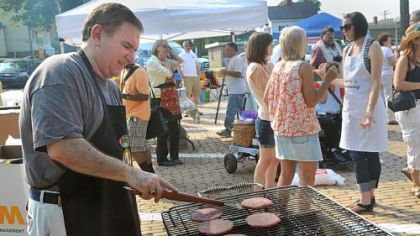 Ernie Ricci of Ricci's Italian Sausage grills some sweet Italian sausage patties during the July 12 "Grill-abration" organized to protest the Bellevue borough council's anti-grilliing ordinance.