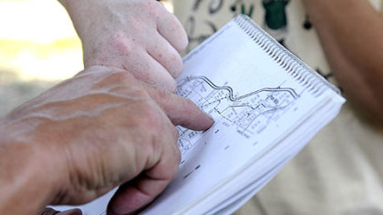 Volunteers discuss where to search for Donald Mariacher.