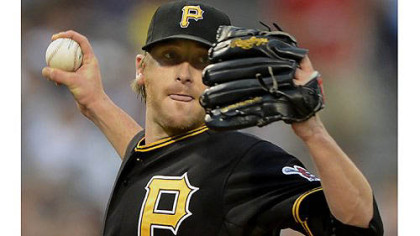 Starter Kevin Correia delivers against the Marlins in Friday night's win at PNC Park.