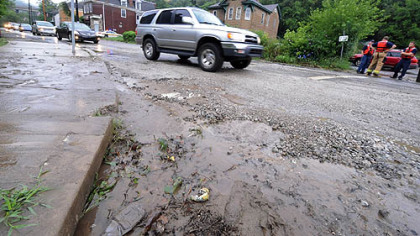 Flooding at Ramp and Baldwin streets in Hays left behind gravel and mud on the roadway.
