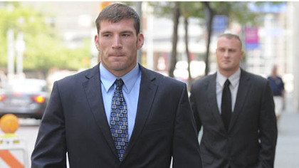 Pittsburgh police officers Michael Saldutte, left, and Richard Ewing arrive Tuesday at the U.S. District Court.