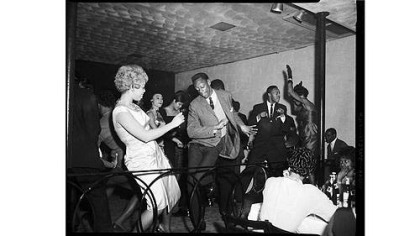 Men and women dancing on stage, including Marcia Cawthon and Ronald Browne.
