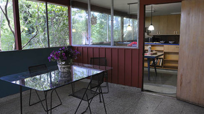 The side entrance and screened-in porch.