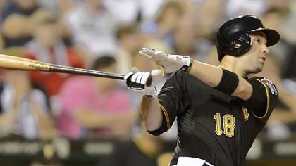 Pirates second baseman Neil Walkers hits a solo home run in the fifth inning Friday against the Marlins at PNC Park.