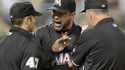 Marlins manager Ozzie Guillen, right, argues with plate umpire Mark Wegner Friday at PNC Park.
