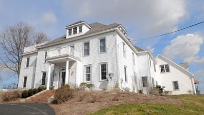 This 2 1/2 story five-bedroom Colonial, built in 1901, is on the market for $1.99 million.  The estate, which includes a horse barn, riding trails and other amenities, sits on 26 acres.