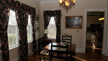 The dinning room features hard wood floors and plenty of natural light.