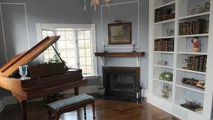 The livingroom features hardwood floors, built-in bookcases and plenty of natural light.