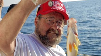 Veterans with physical injuries and stress disorders find comfort aboard the Lake Erie head boat O'Danny O. Larry Lipinski of Erie shows off a nice yellow perch.