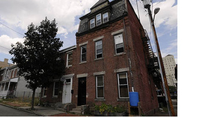 Cyberpunk Apocalypse's brick building at 1200 Boyle St., North Side, tells of a city in flux.