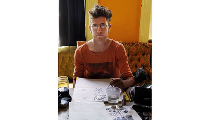 Resident Daniel McCloskey works on his comic, "Top of the Line" at the artist collective Cyberpunk Apocalypse on the North Side