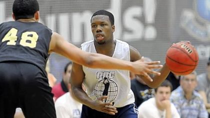 Duquesne's Derrick Colter moves the ball up court at the summer basketball league championship Wednesday night.