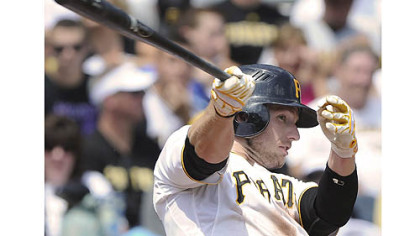 Pirates' Alex Presley singles in the first inning against the Marlins.