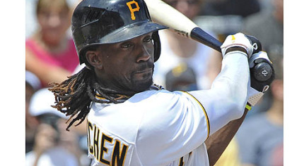 Pirates' Andrew McCutchen singles in the first inning against the Marlins.
