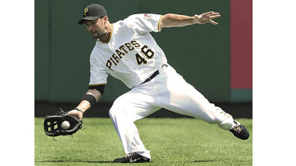 Pirates' Garrett Jones makes a diving catch in right field against the Marlins.