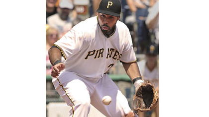 Pirates' Pedro Alvarez can not handle the hard hit ball by the Marlins' Logan Morrison.