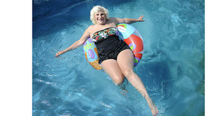 Dolores Grandizio, 83, floats in her pool in Valencia.  Ms. Grandizio, who has had surgery on her spine to correct scoliosis, said swimming and dancing are her two favorite ways to exercise.