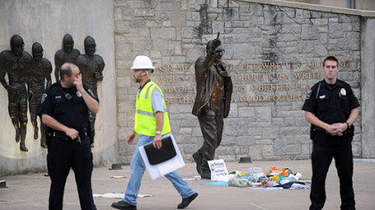 Police and construction workers have surrounded the Joe Paterno statue in State College on Sunday.