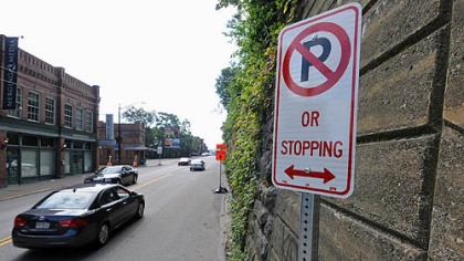 A haven of free street parking on eastbound East Carson Street has ended with the posting of "no parking" signs. The area will become a bike lane.