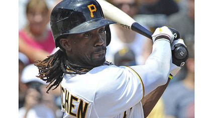Pirates' Andrew McCutchen singles in the first inning against the Marlins.