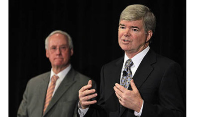 NCAA President Mark Emmert, and Ed Ray, NCAA Executive Committee announce the penalties against Penn State.