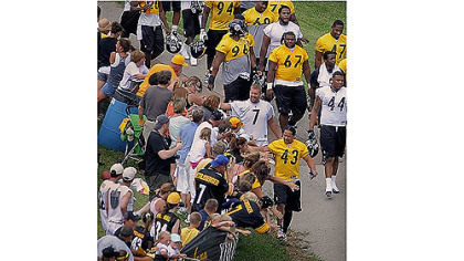 Fans reach out to touch Ben Roethlisberger and Troy Polamalu before camp begins.