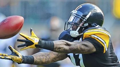 Mike Wallace, reaching for a catch in a game last season against Seattle.