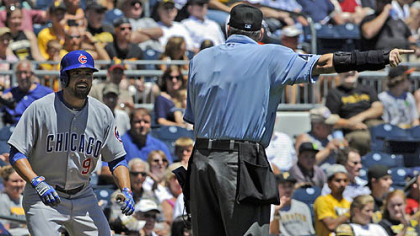 Cubs' David DeJesus is told to go back to second base by home plate umpire Andy Fletcher after a hit to deep center was reviewed and ruled a ground-rule double against the Pirates Wednesday afternoon.