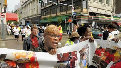 "One Pittsburgh" crosses Wood Street as it makes its way up Forbes Avenue for a National Day of Action march to raise the minimum wage.
