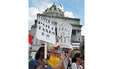 Demonstrators at an NAACP-organized rally gather Tuesday on the steps of the Pennsylvania Capitol to protest the state's new voter identification law.