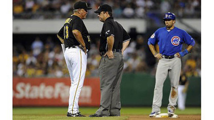 Pirates manager Clint Hurdle argues with second base umpire Rob Drake after Cubs' David DeJesus was called safe at second base on a tag by Pirates' Neil Walker in the seventh inning.