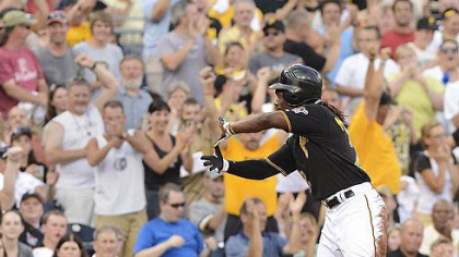 Andrew McCutchen makes the sign of Zoltan after hitting triple.