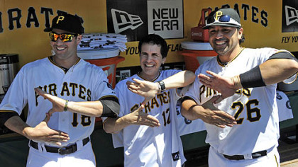 Hal Sparks, the actor of "Zoltan" fame in "Dude, Where's My Car," poses with Pirates' Neil Walker and Rod Barajas in the dugout before the start of the game against the Cubs this afternoon. Sparks threw out the first pitch.