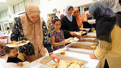 Pittsburgh Muslims enjoy iftar, the evening feast when Muslims break fast during the Islamic holy month of Ramadan, at the Muslim Community Center in Monroeville on Monday.
