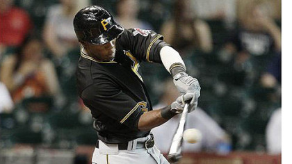 Starling Marte drives a ball to left center field for a home run in the first inning against the Houston Astros.