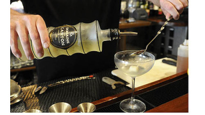 Soba's Rob Hirst pours Domaine de Canton into the Fussy Monk cocktail.