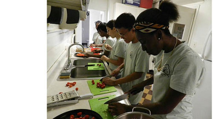 High school interns work together to prepare a pasta dinner in the Phipps Garden Center kitchen in Shadyside.