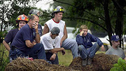 July 27, 2002: Emergency workers and other residents of the Quecreek area waited as drilling rigs raced to get trapped miners out of the flooded Quecreek Mine.