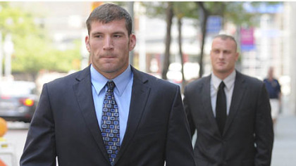 Pittsburgh police officers Michael Saldutte, left, and Richard Ewing arrive Tuesday at the U.S. District Court.