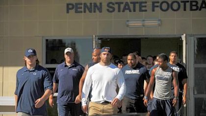 Penn State football team give a statement in support of their team outside of the Lasch building on the Penn State University campus.