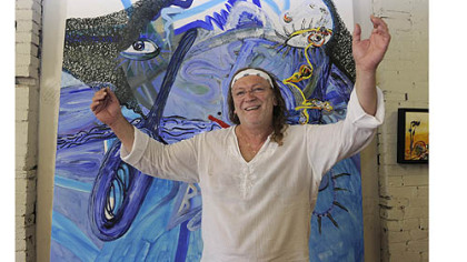 Bulgarian artist Anastas Konstantinov in front of "Mackenzie's Smile" at the Ice House Artist Studios in Lawrenceville.