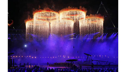 The Olympic rings are illuminated with pyrotechnics as they are raised above the stadium during the Opening Ceremony at the 2012 Summer Olympics in London.