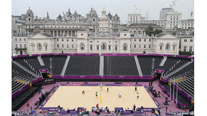 Players warm up during a Beach Volleyball practice session at the 2012 Summer Olympics, Friday in London.