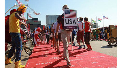 The United States team enjoys the atmosphere during the Olympic Village arrivals ahead of the London 2012 Olympics at the Olympic Park )