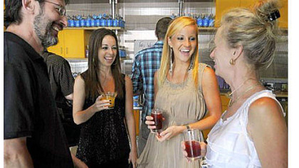Jamie and Ali McMutrie, center, talk with Carl and Judy Johnson of Hampton at the benefit for their nonprofit, Haitian Families First, hosted by Wigle Whiskey Friday in the Strip District.