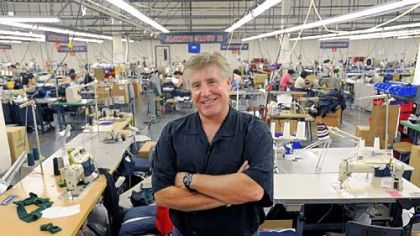 Philadelphia-made uniforms for the 2012 Olympics are designed and manufactured at Boathouse Sports. The company employs about 225 local workers. Here, founder John Strotbeck stands on the sewing floor.