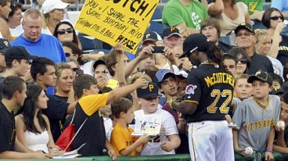 Andrew McCutchen stops to sign autographs before the start of a game Tuesday against the Cubs at PNC Park.